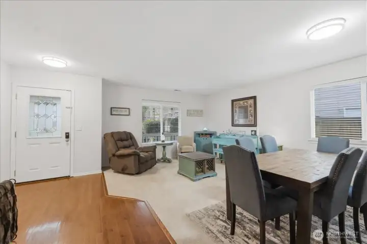 Dining and living room view towards the front door from the kitchen.