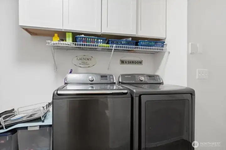 Utility room with pantry just off the kitchen and leads to the garage.
