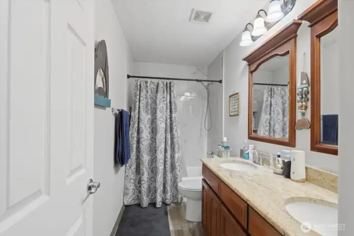 Main bath upstairs features double sinks.