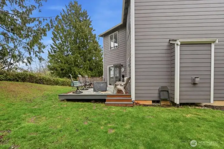 Large side yard with room to throw around a ball.