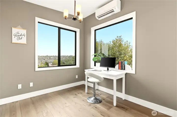 Vaulted ceilings and plenty of room for a large office desk and shelving/added storage