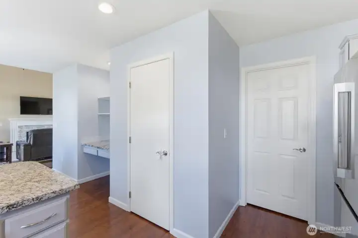 A little desk area and pantry in the kitchen.  The door to the right leads you into the laundry room and then the garage.
