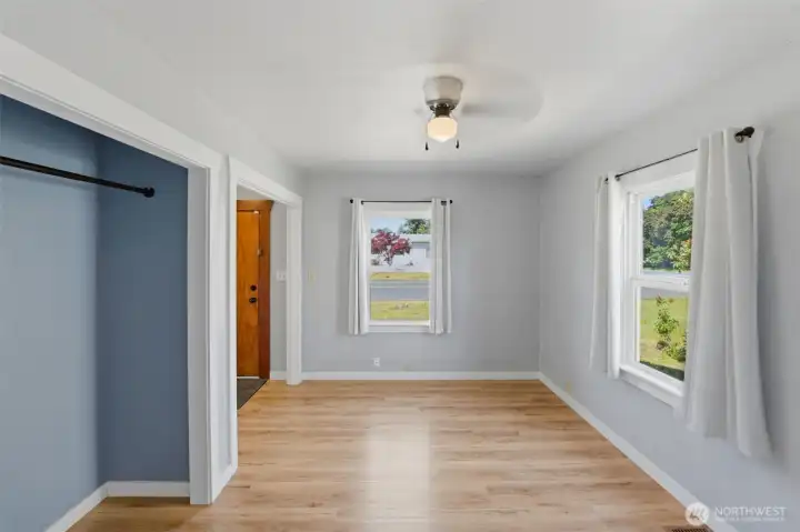 Main-floor Primary bedroom — Bright bedroom with dual windows, a built-in closet, and a ceiling fan, just off the entry.