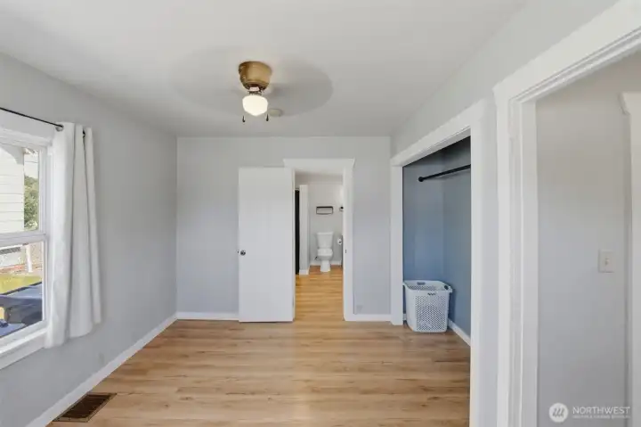 Flexible main-level space — Generous bedroom with closet storage and convenient access to the main bath.