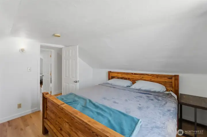 Comfortable upstairs bedroom — Spacious room with natural light.