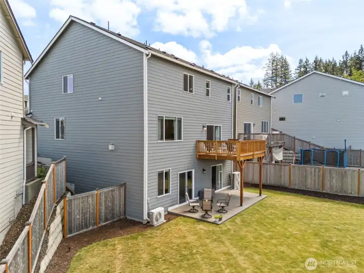 Welcoming backyard space has so much room for play and entertaining.