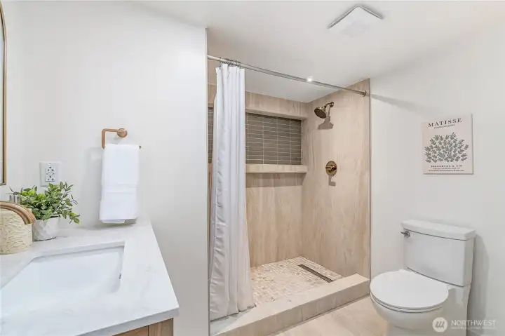 New bathroom with custom tile shower, lower level
