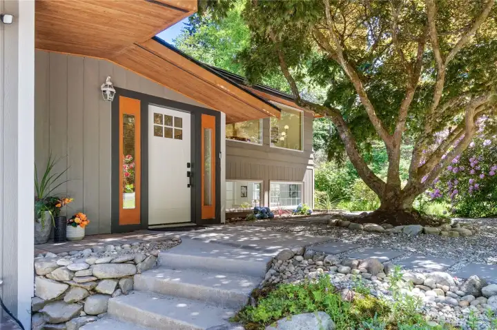 Inviting door and patio with shade of trees