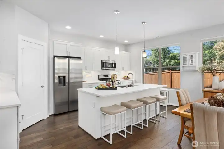 Walk-in pantry to left includes shelving from top to bottom.