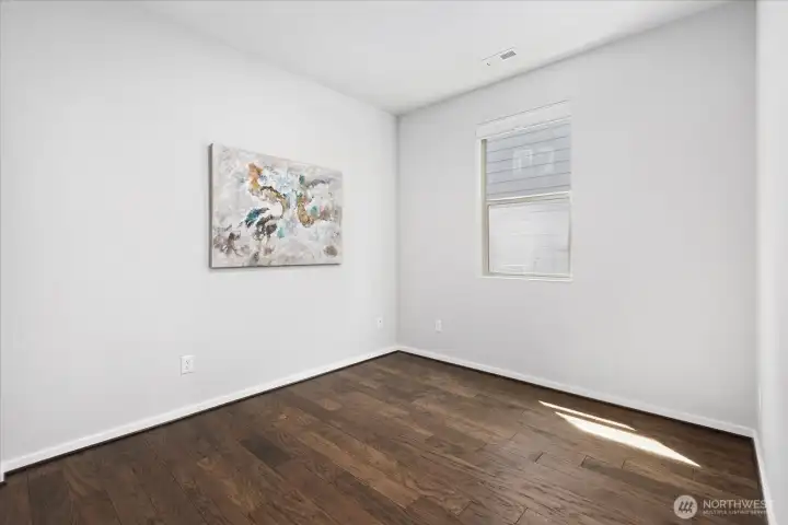 Main floor bedroom for guests, multi-generational living, office? 3/4 bathroom next to it.