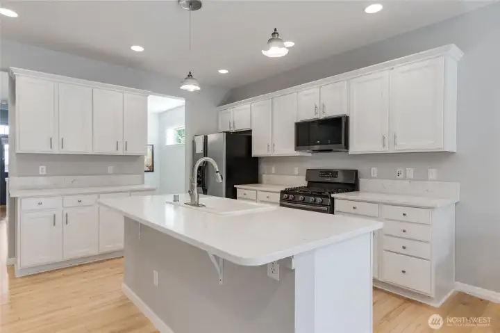 Beautiful transitional styling is right in-line with what you have been looking for.  The owners had the island "leveled" for optimal use and presentation.  Quartz countertops and professionally painted cabinets combine to create such a beautiful space.