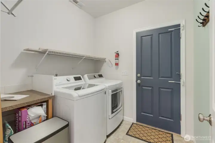 The laundry room is conveniently located on the main floor and is the perfect spot to come in from the garage/outside.