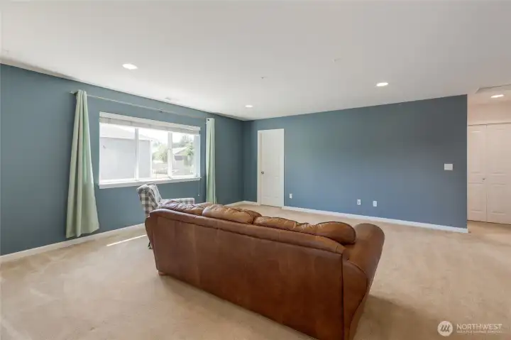 Upstairs you will find this bonus room/media room/play room, so many options here.  Adjacent to this space are the home's two secondary bedrooms and a full bathroom.