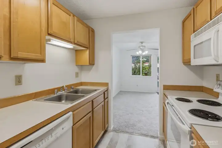 There is a display shelf on top of the cabinets. There is a display shelf on top of the cabinets.