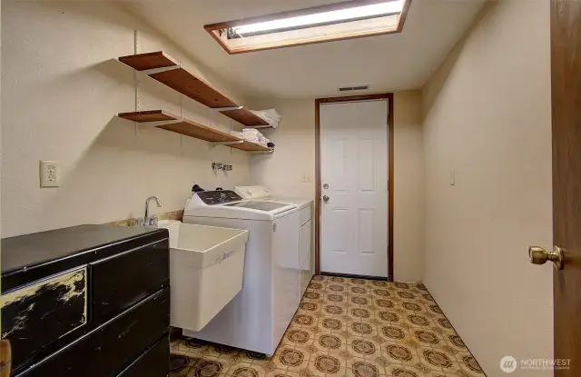 laundry room with door to back yard