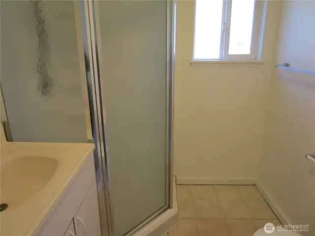 Bath with toilet, sink, and shower.