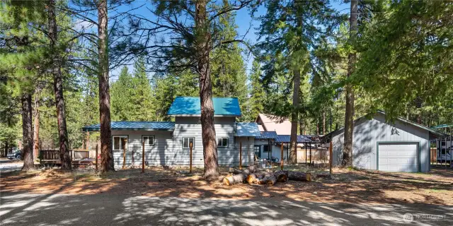 Side of house, front of garage, and RV Camper Area