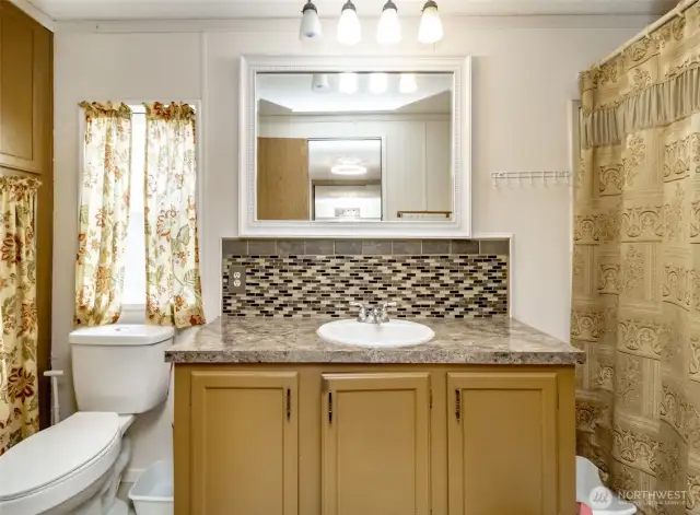 Enjoy complete privacy from the rest of the home in your private bath located in your spacious primary bedroom!