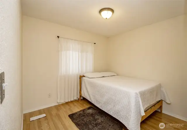 Bedroom number one is bright and spacious!