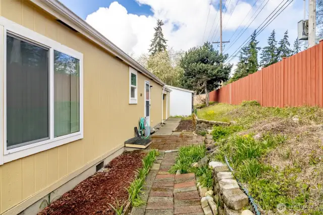Enjoy a paved walkway in the backyard!