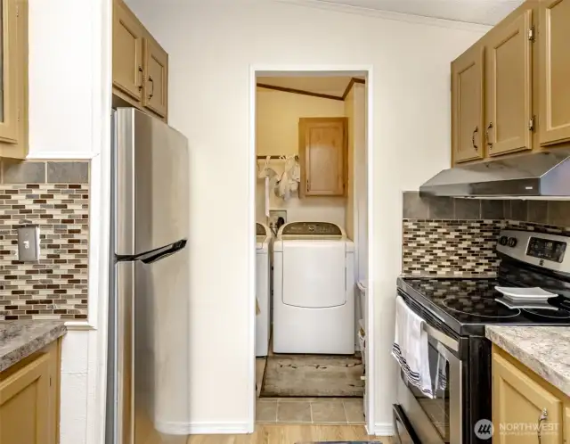 Don't miss the washer and dryer area - conveniently tucked away with space for all your laundry needs.