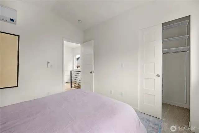 Large primary bedroom with lots of natural light period