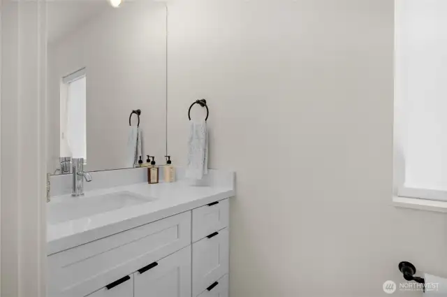 Spacious half bathroom on the main level