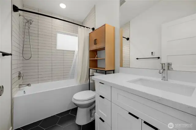 Main bathroom with deep soaking tub.
