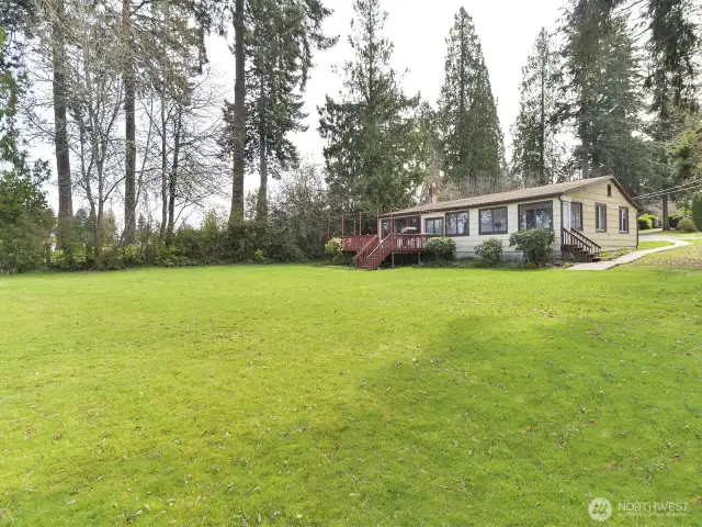Unique lakefront property, two houses, shop, toolshed, garage.  Over .75 acre