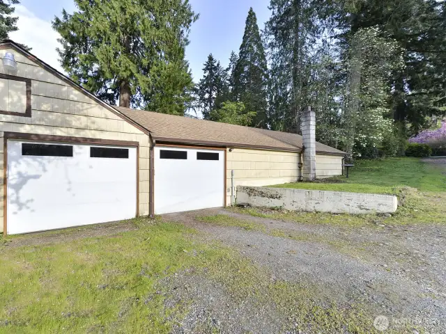 2 car garage, shop to right, new power doors