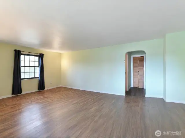 Main floor living room.  New floor, marble entry, new windows
