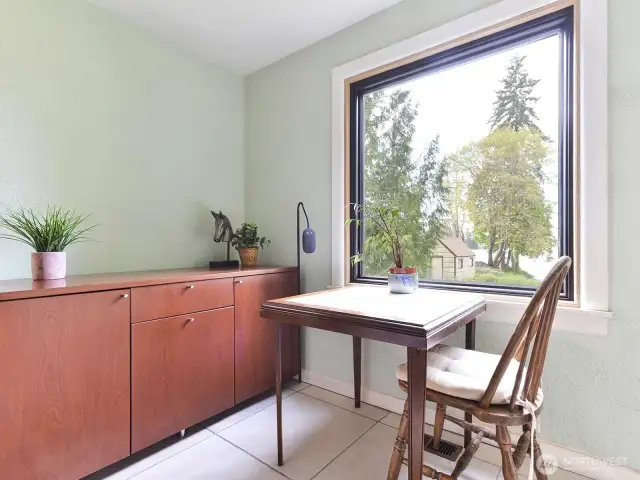 Main floor entry features picture window showing lake