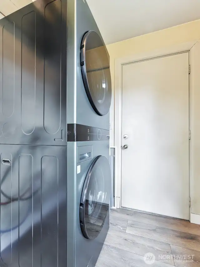 Big laundry room has new floor.  LG laundry center stays