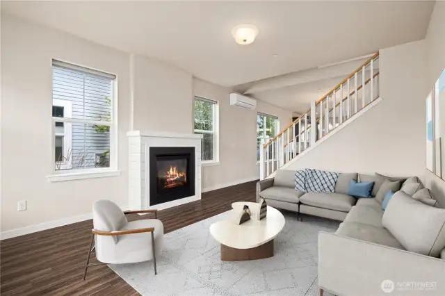 There is a great gas fireplace to warm you on those chilly winter days and nights. The dining area and kitchen are just beyond the stairway that leads to two beds and a full bath.