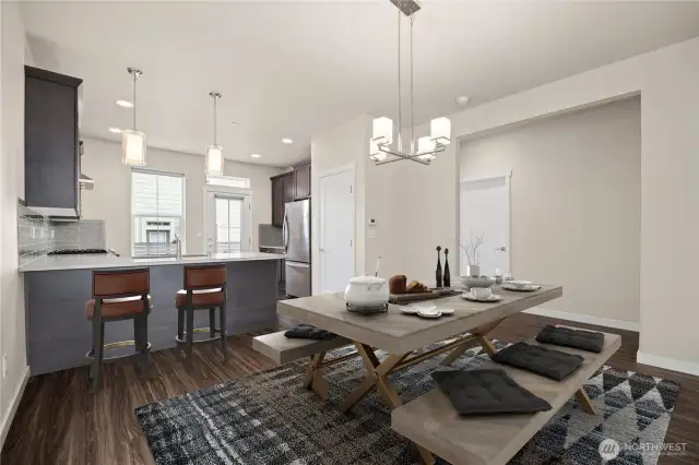 Looking at the dining room with the kitchen beyond.