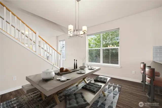 The dining area is spacious and open to the kitchen.
