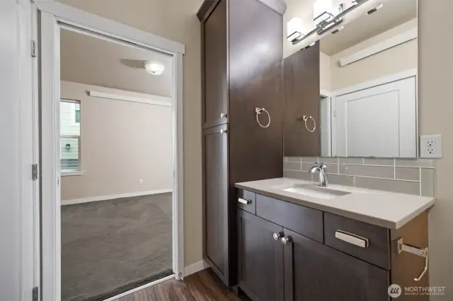 There is a 3/4 bath on the main floor just off the dining area, and it also opens to the main floor primary bedroom.