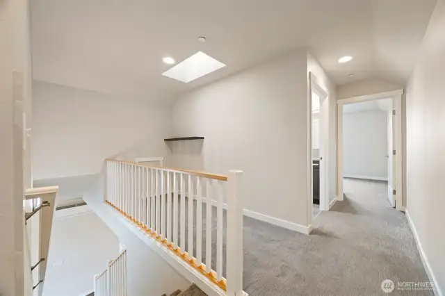 Looking at the landing of the stairway which could be an office, studio or a play area. Great natural light with the skylight above.