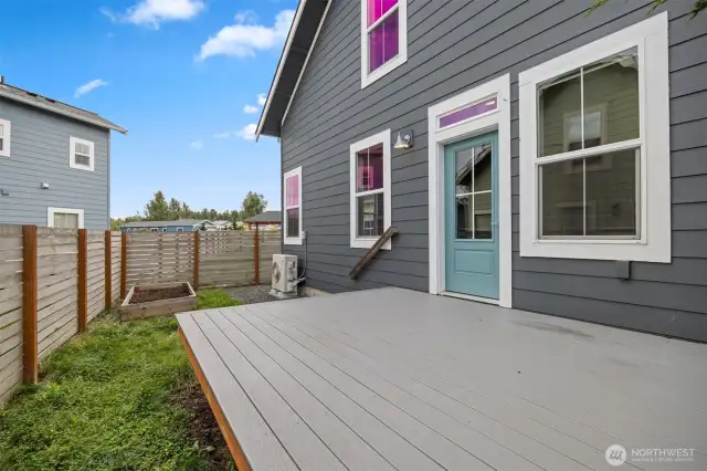 The rear yard is fully fenced and has raised garden beds.