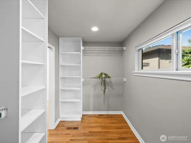 Another view of primary bedroom walk in closet