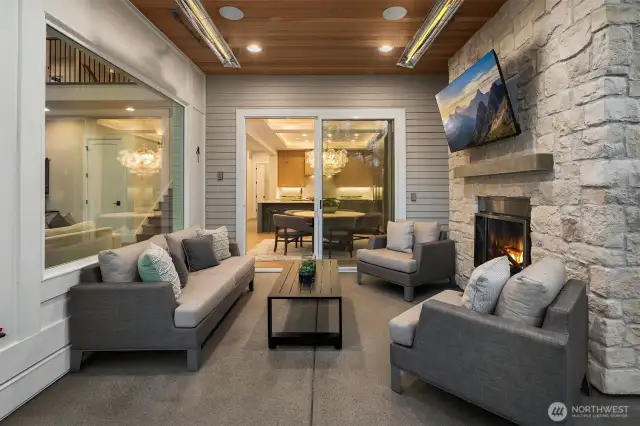 Outdoor covered living area with fireplace