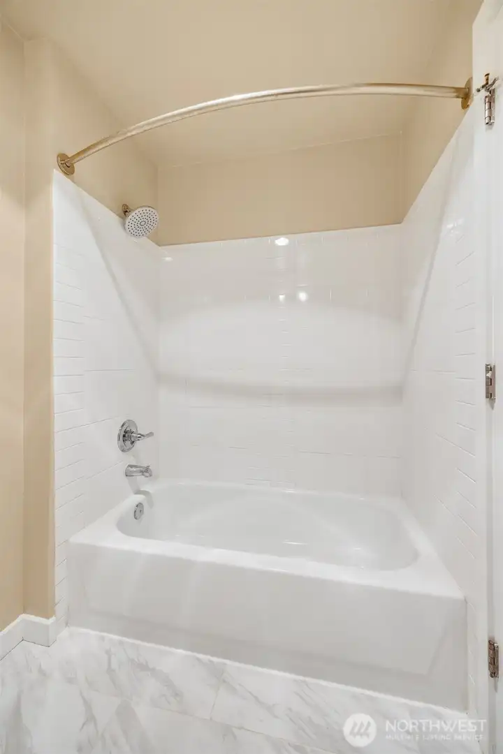 Bathroom with tiled walls and floors
