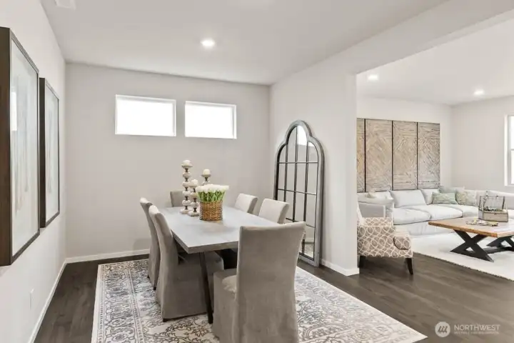 Formal dining room for entertaining. Photo is representational. Actual home is under construction. Colors, materials, and features may vary. See site agent for details.