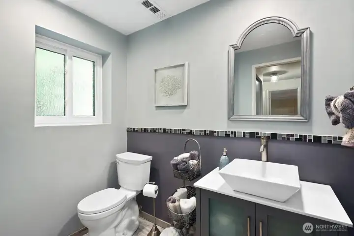 Nicely remodeled 3/4 bath serves the downstairs area.