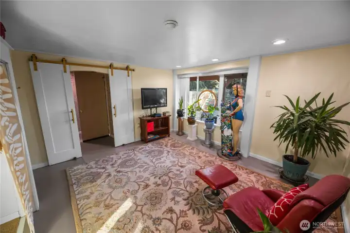 Such a fun bedroom.  Loving the double barn doors.