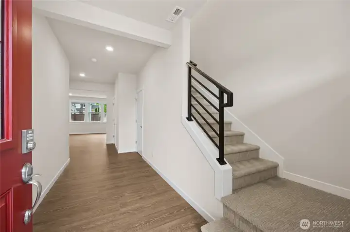 Wide entry with open, metal railing. Photo is representational. Actual home is under construction and materials, colors, and finishes will vary. See site agent for details.