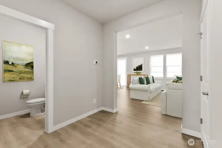 Main level powder room.  Photo is representational. Actual home is under construction and materials, colors, and finishes will vary. See site agent for details.