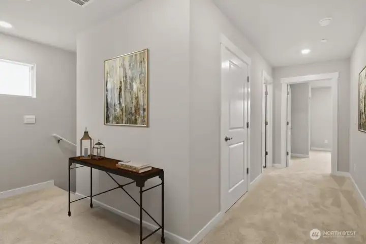 Upstairs hallway, notice the windows to let natural lights? Photo is representational. Actual home is under construction and materials, colors, and finishes will vary. See site agent for details.