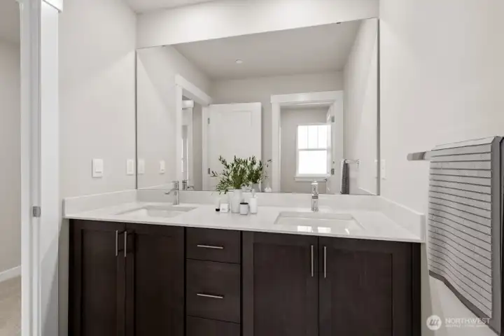 Hallway full bath with double sink vanity with door separating shower. Photo is representational. Actual home is under construction and materials, colors, and finishes will vary. See site agent for details.
