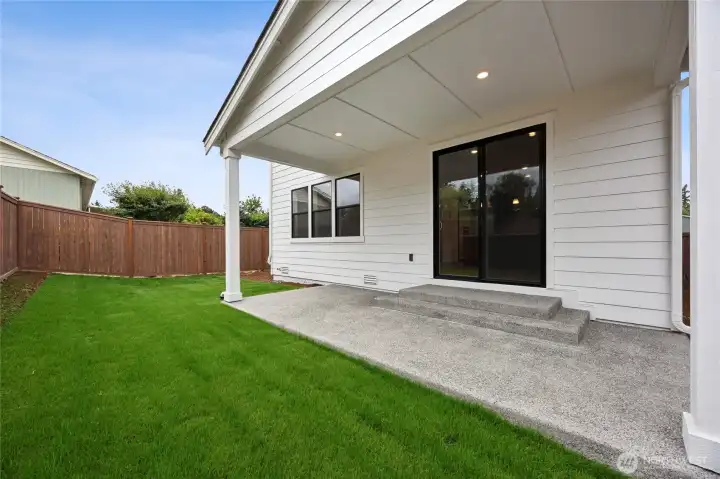 Private backyard with covered patio & fully fenced backyard.